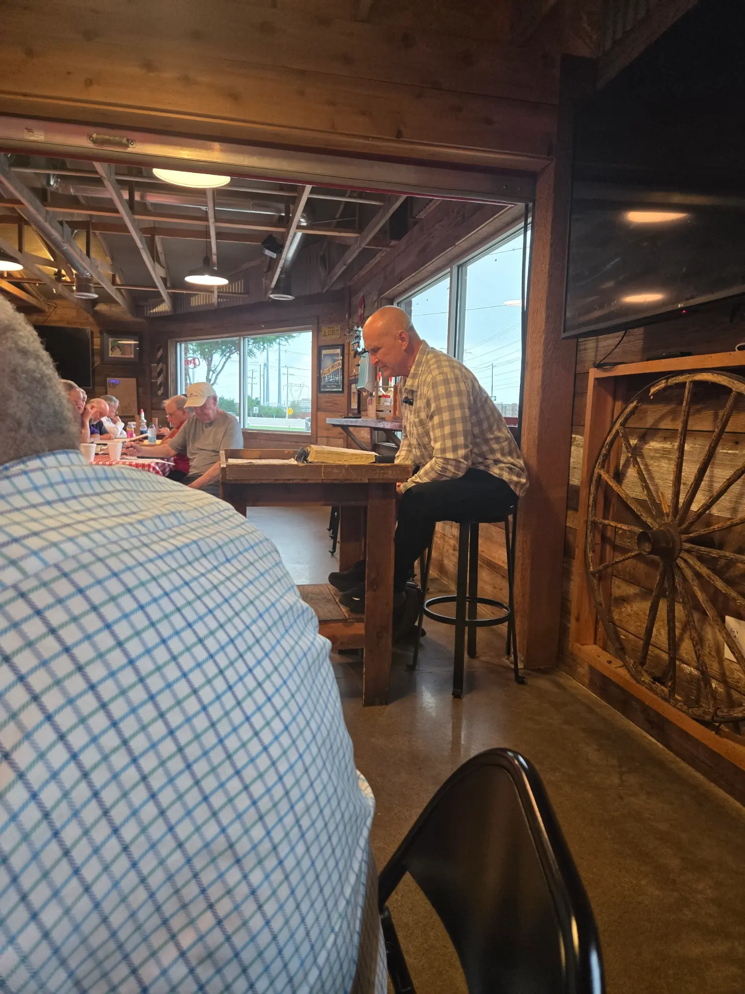 Bernard Bourque teaching from the Bible at a restaurant venue